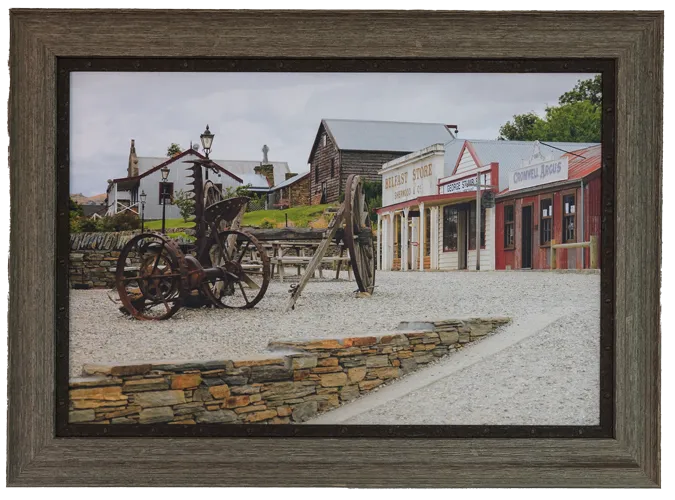 a photo of a framed cromwell print. The picture is of old cromwell town and is framed by creative framing.